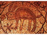 The mosaic floor of the synagogue at Beth Alpha (6th C AD) showing a rabbit eating grapes.